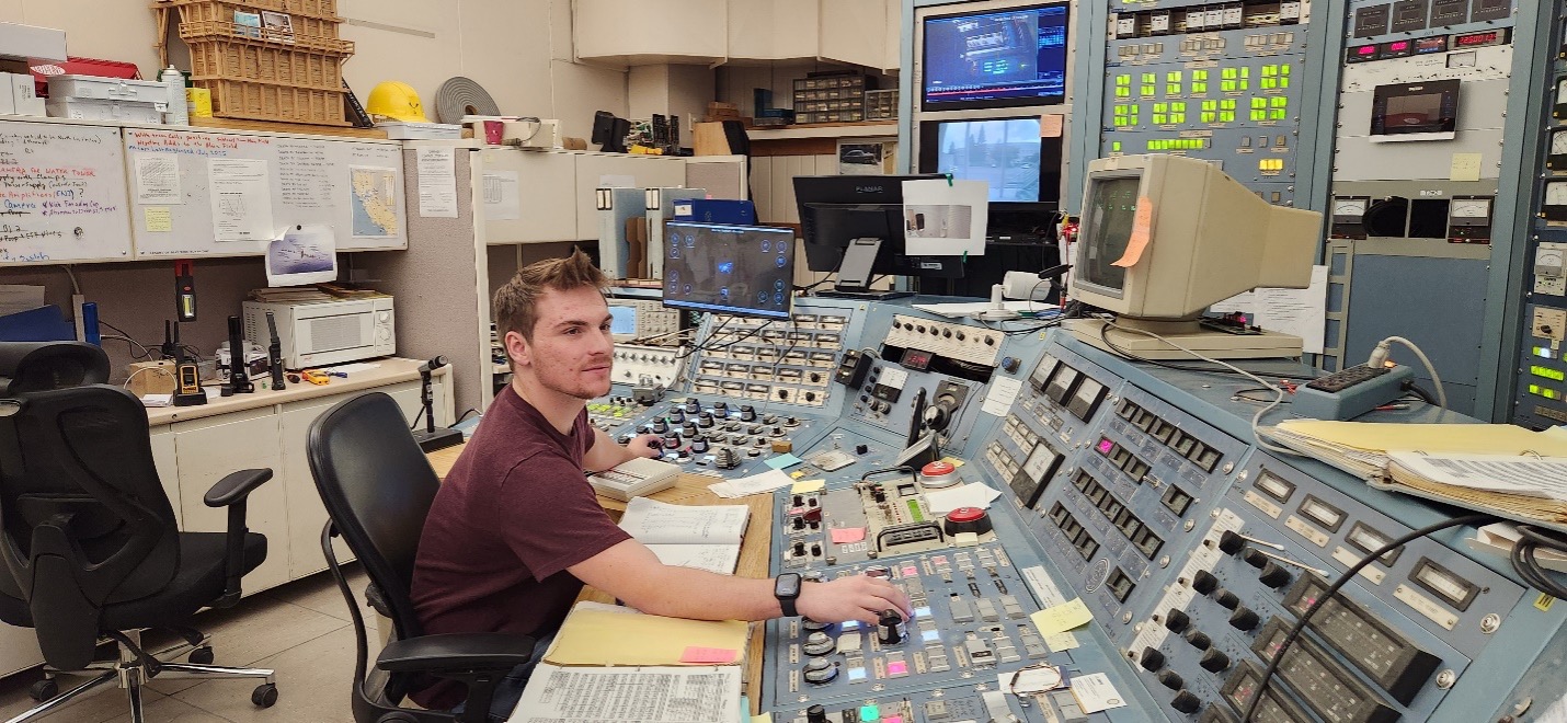 Novotny operating the cyclotron in the control room