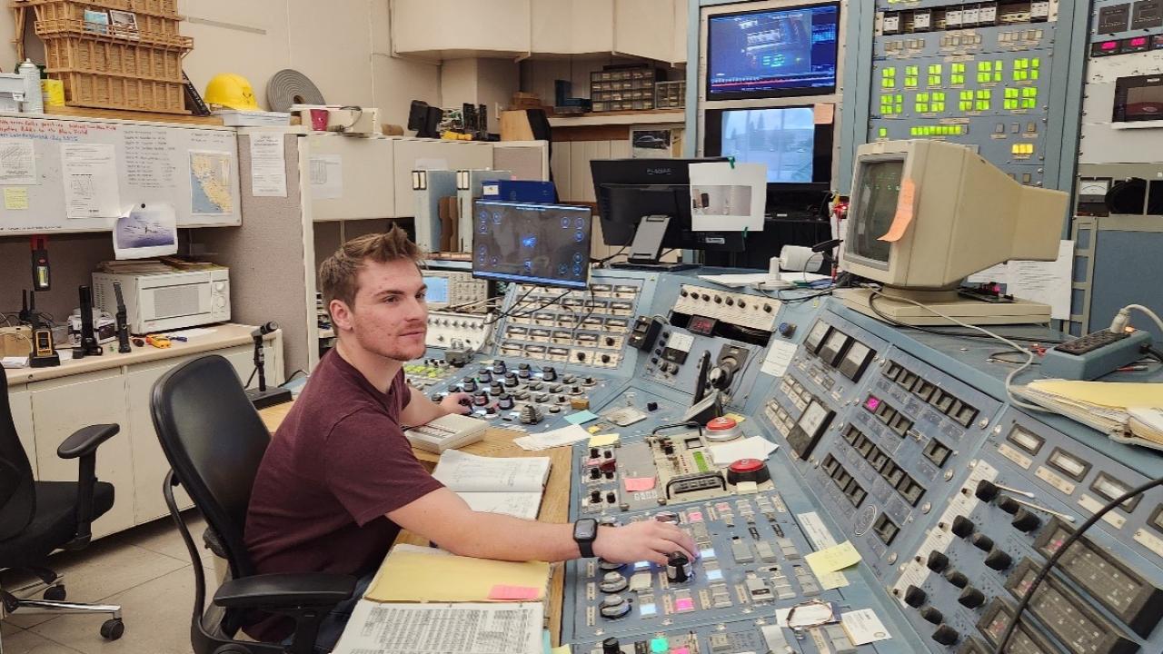 Novotny operating the cyclotron in the control room